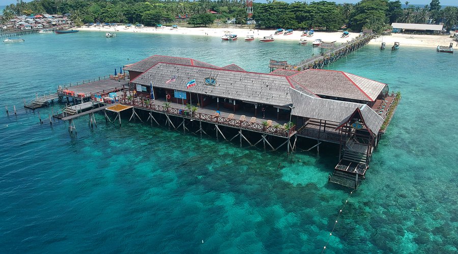 mabul resort jetty at sunset where sipadan divers stay
