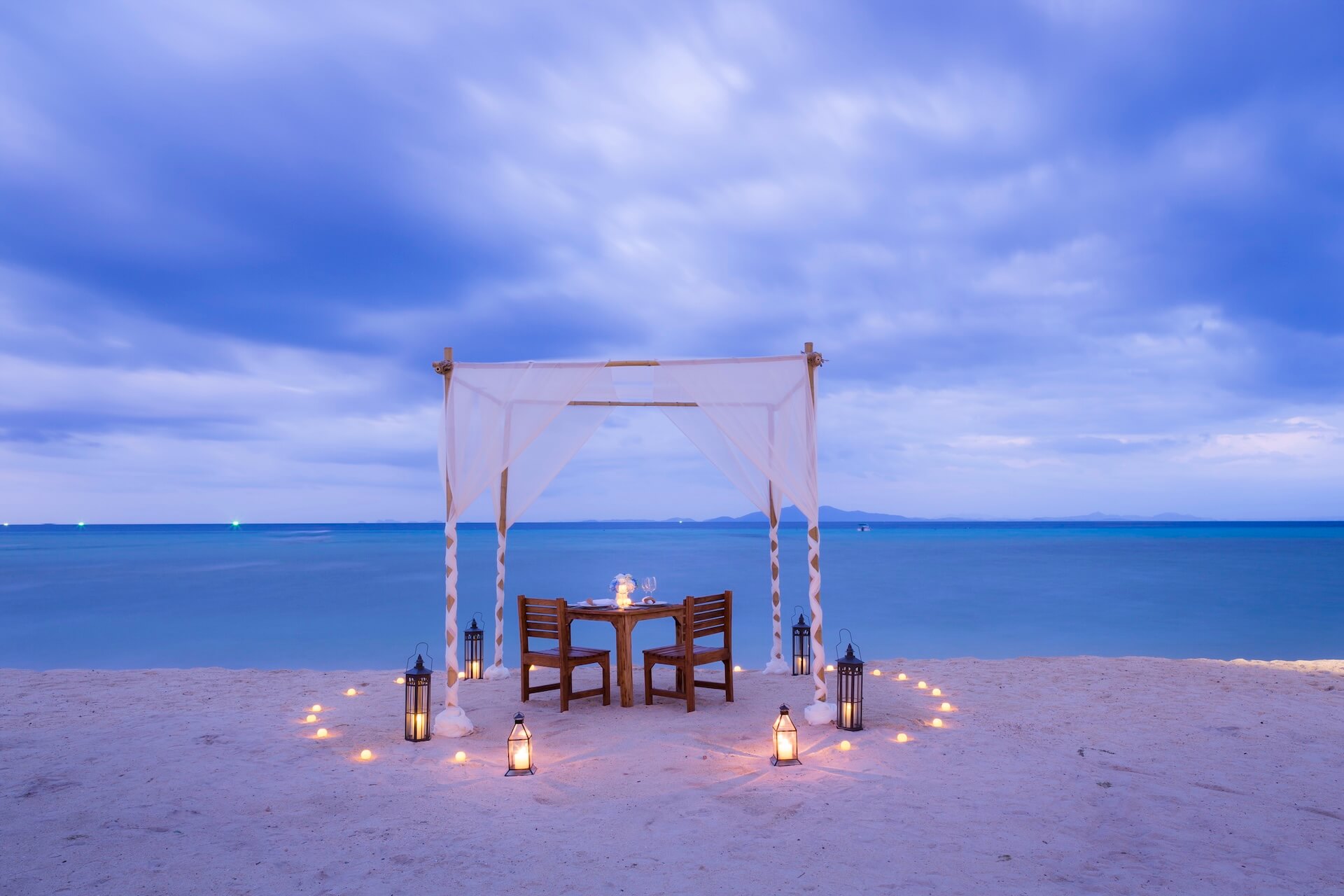 private beach dinner setup on mataking island