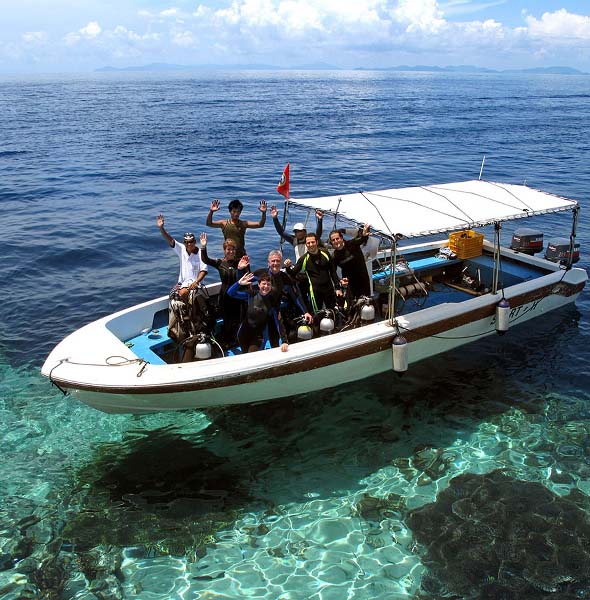 guests on the dive boat during a sipadan package day